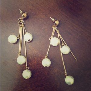 Dangling pearl earrings